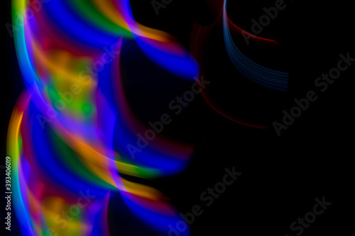 multicolored rainbow lines on black background