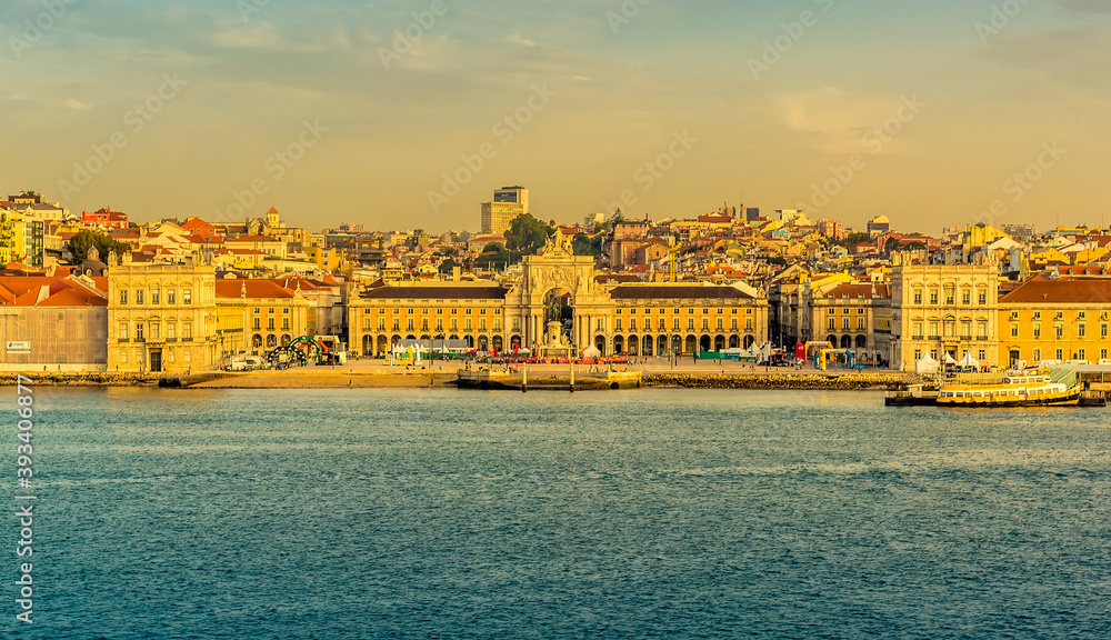 A close up view from the river Tagus towards the Commercial Square, Lisbon, Portugal in the early morning light at sunrise in Autumn