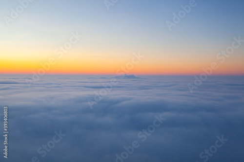 Amazing sunrise above clouds from the top of the mountain