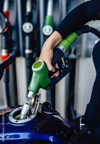 Принти на полотні Modern motorcycle is fueling with petrol