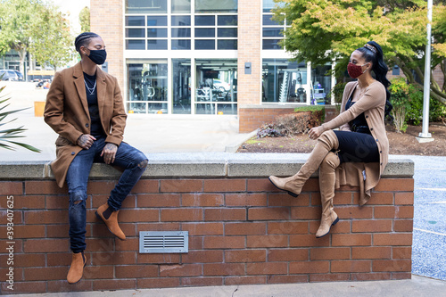 Obraz na plátně Two African American women wearing masks to protect from the Covid-19 coronaviru