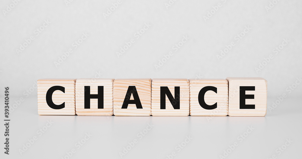 Fototapeta Wooden cube with word CHANCE on table background