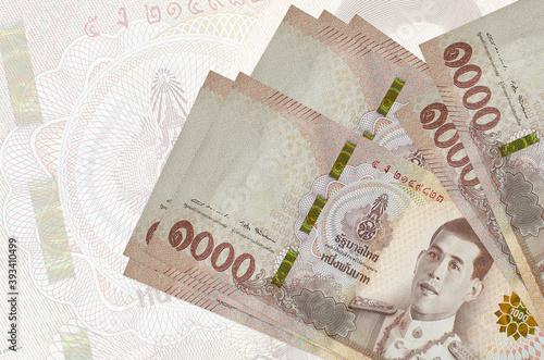 Valokuvatapetti 1000 Thai baht bills lies in stack on background of big semi-transparent banknote