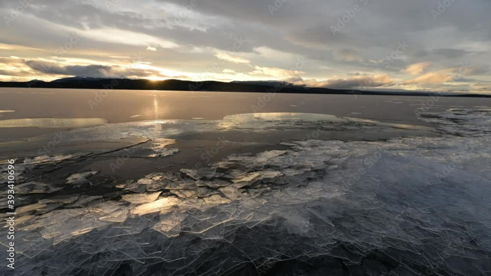 Ice piling up on the lake shore of a lake in Yukon Territory that is ready to freeze for the long, harsh and bitterly cold winter in northern Canada. Ice piling up on the lake shore of a lake in Yukon Territory that is ready to freeze for the long, harsh and bitterly cold winter in northern Canada.
