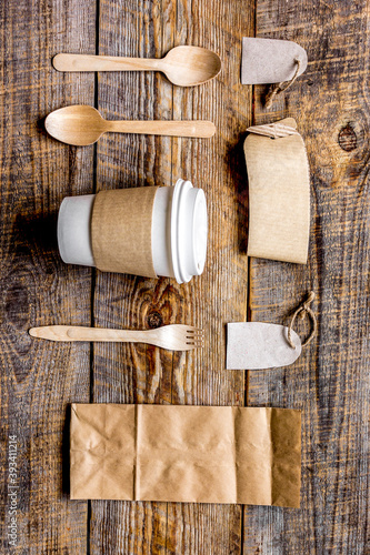 food delivery workdesk with paper bags and flatware table background top view mock-up