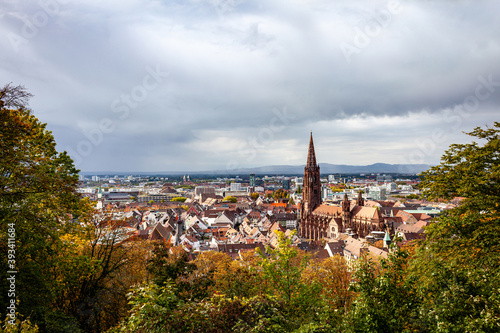 View of Freiburg im Breisgau, cathedral and mountains on a clear sunny autumn day