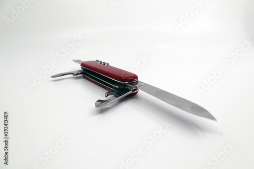 a red military knife for travel and outdoor use. photo