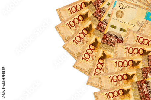 1000 Kazakhstani tenge bills lies isolated on white background with copy space. Rich life conceptual background photo