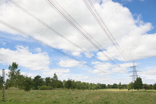 Wide angle lines of over head power cables converging to a pylon