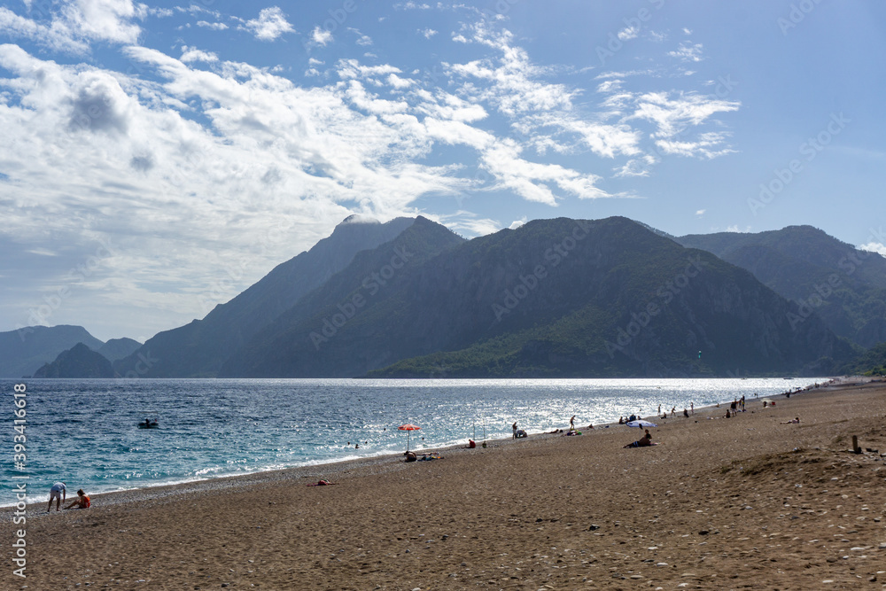 Summer mediterranean coastal landscape. View of Cirali Beach from ancient Olympos ruins, with mountains in background Antalya Turkey. Summer mediterranean coastal landscape. View of Cirali Beach from ancient Olympos ruins, with mountains in background Antalya Turkey.