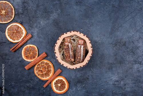 New Year's set for mulled wine in a wood box. Fragrant spices, orange peel, cinnamon sticks, badyan.