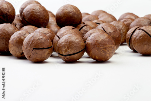 macadamia nuts with clipping path on white isolated background. Selective focus