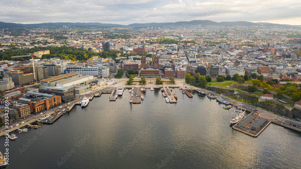 Oslo, Norway. Beautiful panoramic aerial view photo from flying drone to Oslo City Hall (Oslo radhuset)  is a municipal building in Oslo, the capital of Norway. Against the background of port yachts.