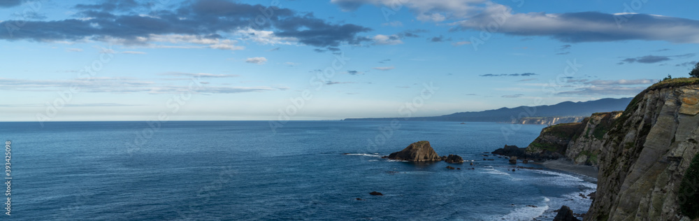 panorama of rugged and wild coastline in northern Spain with cliffs and rocky beach panorama of rugged and wild coastline in northern Spain with cliffs and rocky beach