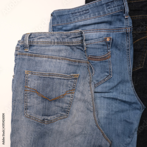 Different kinds of blue jeans, denim on white background