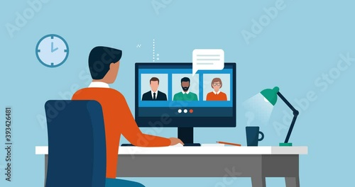 Businessman videocalling his team online and teleworking