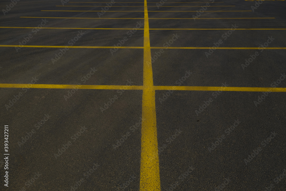 yellow lines in the big black asphalt international way, asphalt parking area, car park 