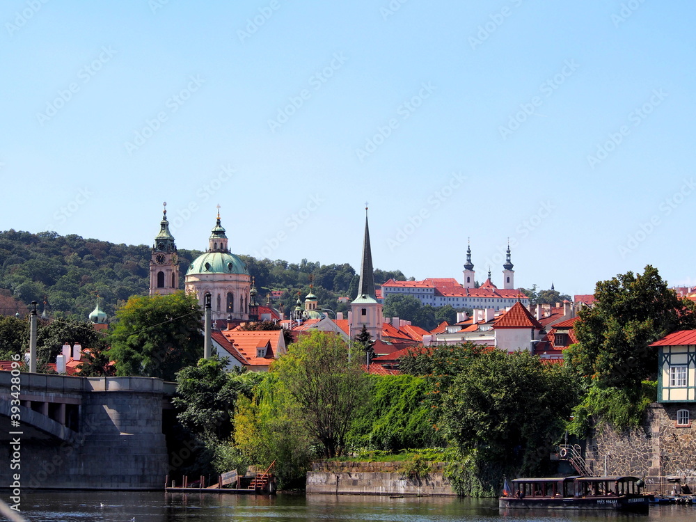view of Prague from the deck of a steamer, historical city center, panorama on the Vltava, sunny summer day, tourism
