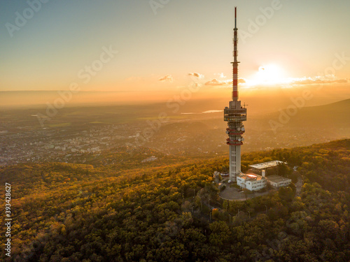 Foto Hungary - TV tower in Pecs with Mecsek hills from drone view