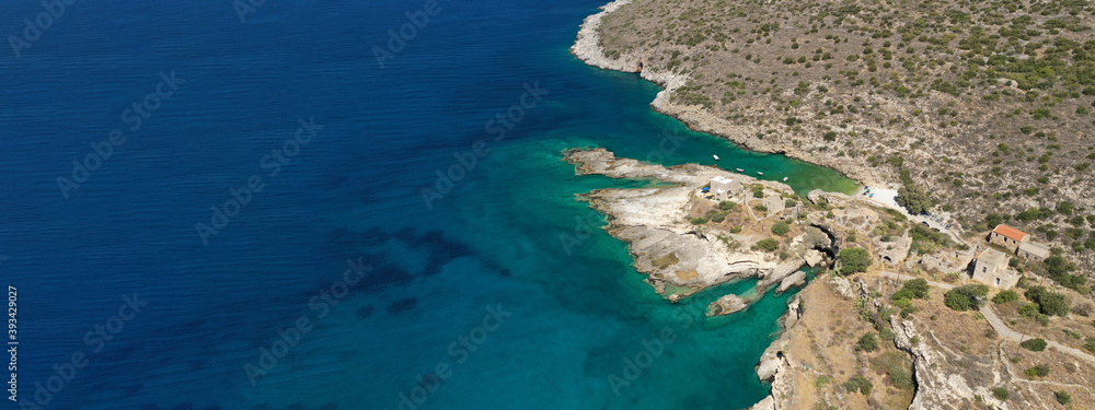 Aerial drone ultra wide photo of beautiful scenic seaside village and bay of Mezapos with crystal clear emerald sea, Lakonia, Mani peninsula, Greece