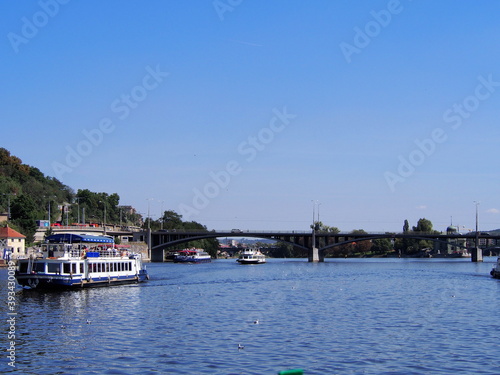 view of Prague from the deck of a steamer, historical city center, panorama on the Vltava, sunny summer day, tourism