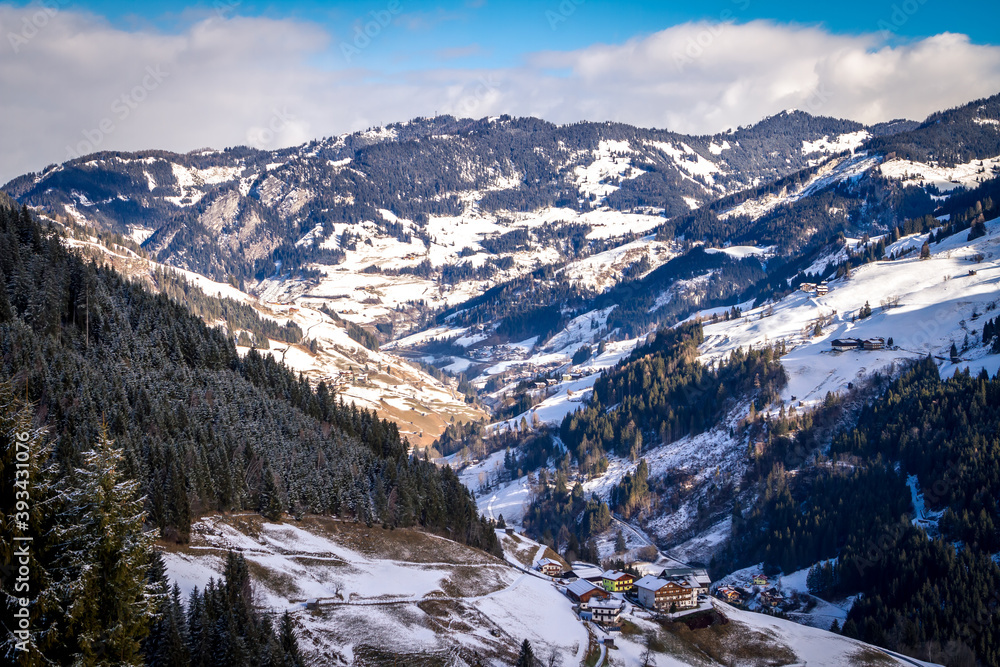 typical Austrian houses against the backdrop of the Gastein valley. Sports region Bad Gastein, Austrian Alps.
