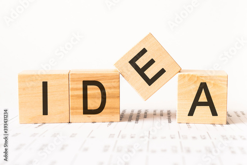 Word idea. Wooden small cubes with letters isolated on white background with copy space available.Business Concept image.