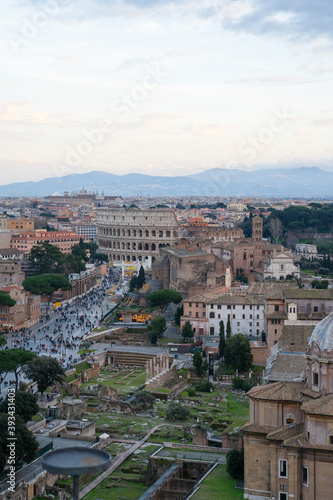 View over historical Rome with many tourists in streets