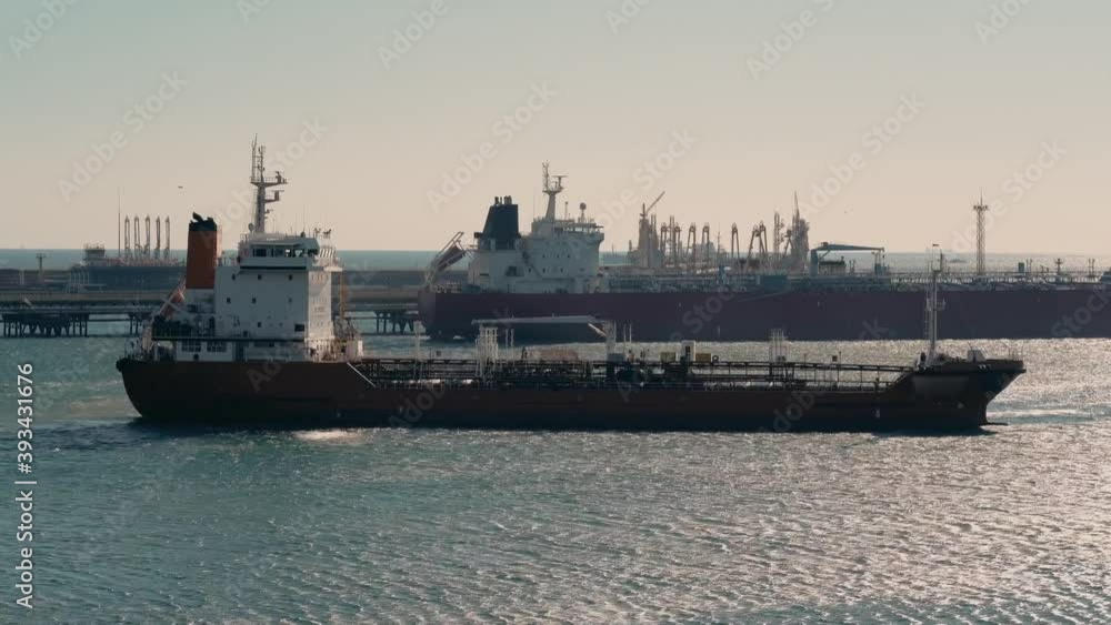 Big cargo nautical ship in port. Commercial sea transportation and logistic concept. Big cargo nautical ship in port. Commercial sea transportation and logistic concept.