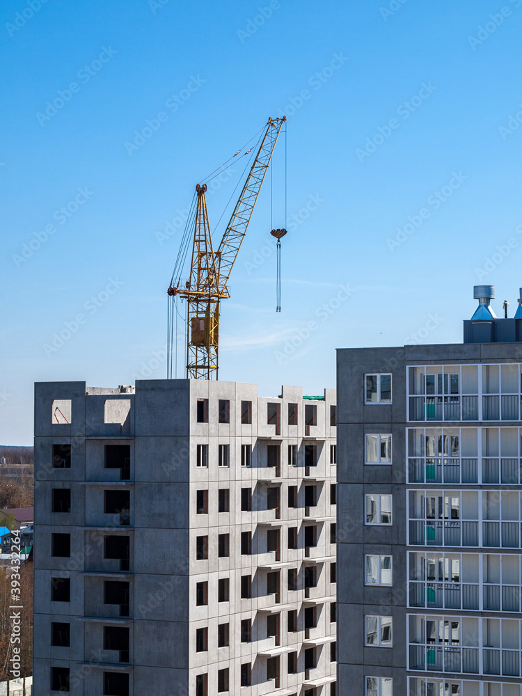 Construction crane for lifting and mounting panels, blocks in the construction of residential buildings, high-rises, skyscrapers Construction crane for lifting and mounting panels, blocks in the construction of residential buildings, high-rises, skyscrapers