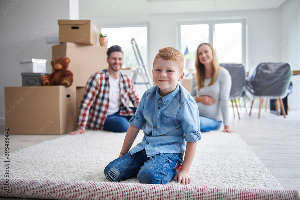 Portrait of happy family moving into new flat Portrait of happy family moving into new flat