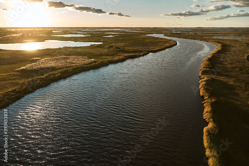 USA, Maryland, Drone view of marsh along Blackwater River at sunset photo