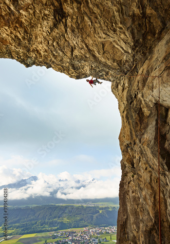 Austria, Innsbruck, Martinswand, man climbing in grotto