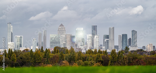 Canvas Print Canary Wharf Skyline and Trees Under with Sun Flare Looking North