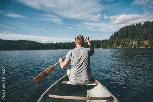 Canada, British Columbia, man in canoe on Cultus Lake photo