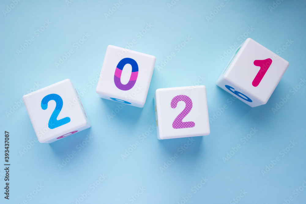 Cubes with colorful numbers 2021 on blue background. New year, calendar Cubes with colorful numbers 2021 on blue background. New year, calendar