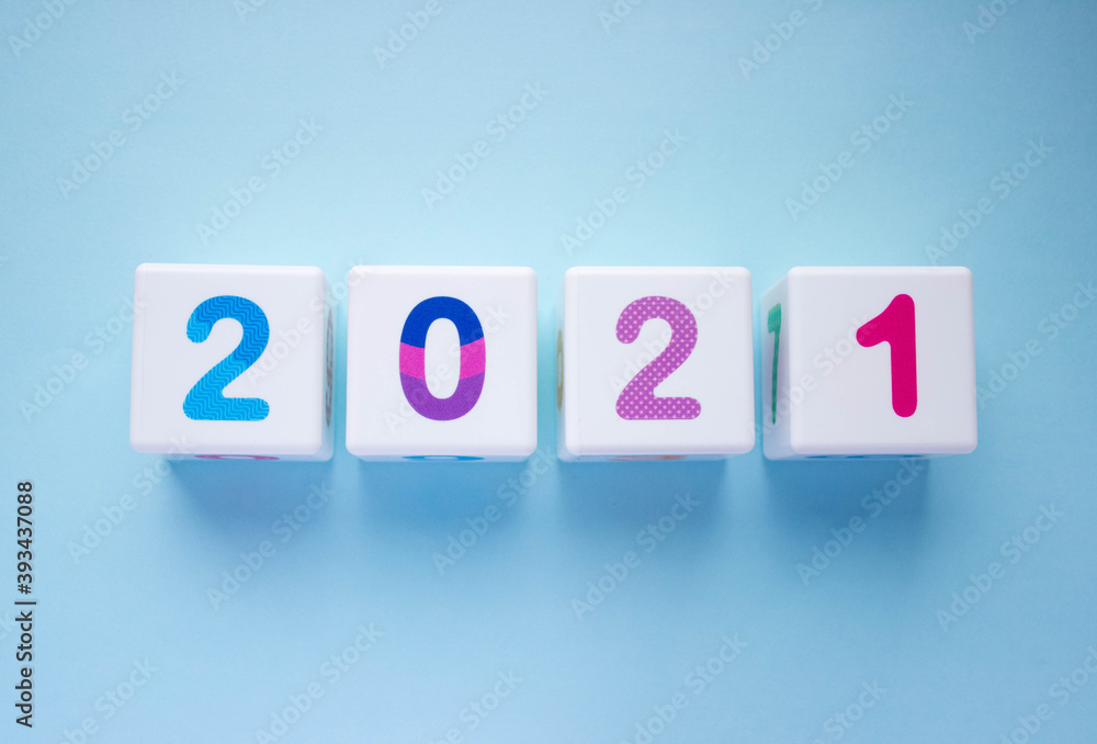 Cubes with colorful numbers 2021 on blue background. New year, calendar Cubes with colorful numbers 2021 on blue background. New year, calendar