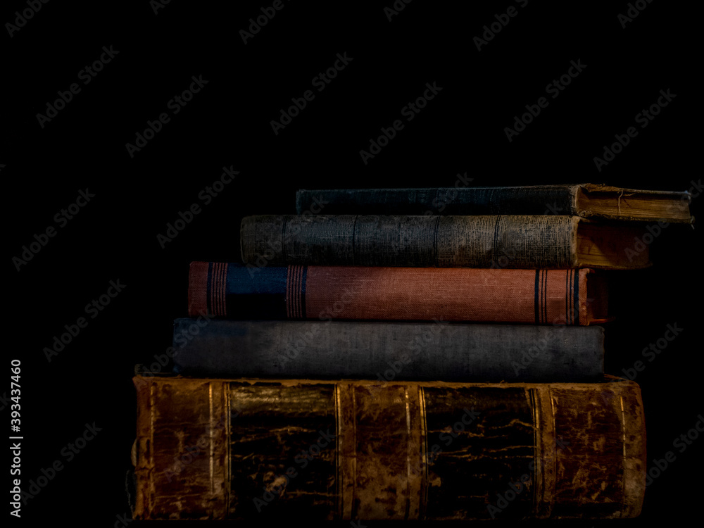 Old Books Stacked on a Bookshelf Old Books Stacked on a Bookshelf