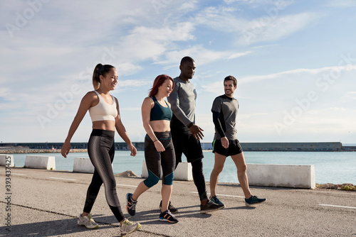 Group of sportspeople walking photo