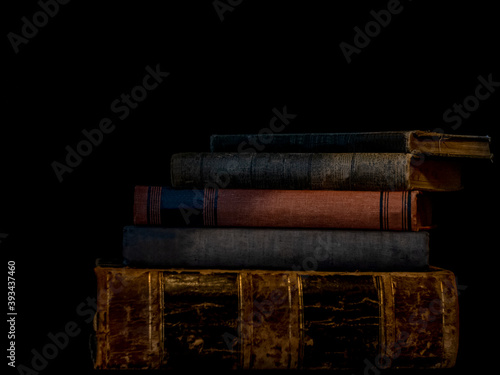 Old Books Stacked on a Bookshelf