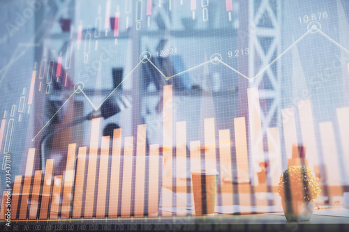 Double exposure of stock market graph drawing and office interior background. Concept of financial analysis.