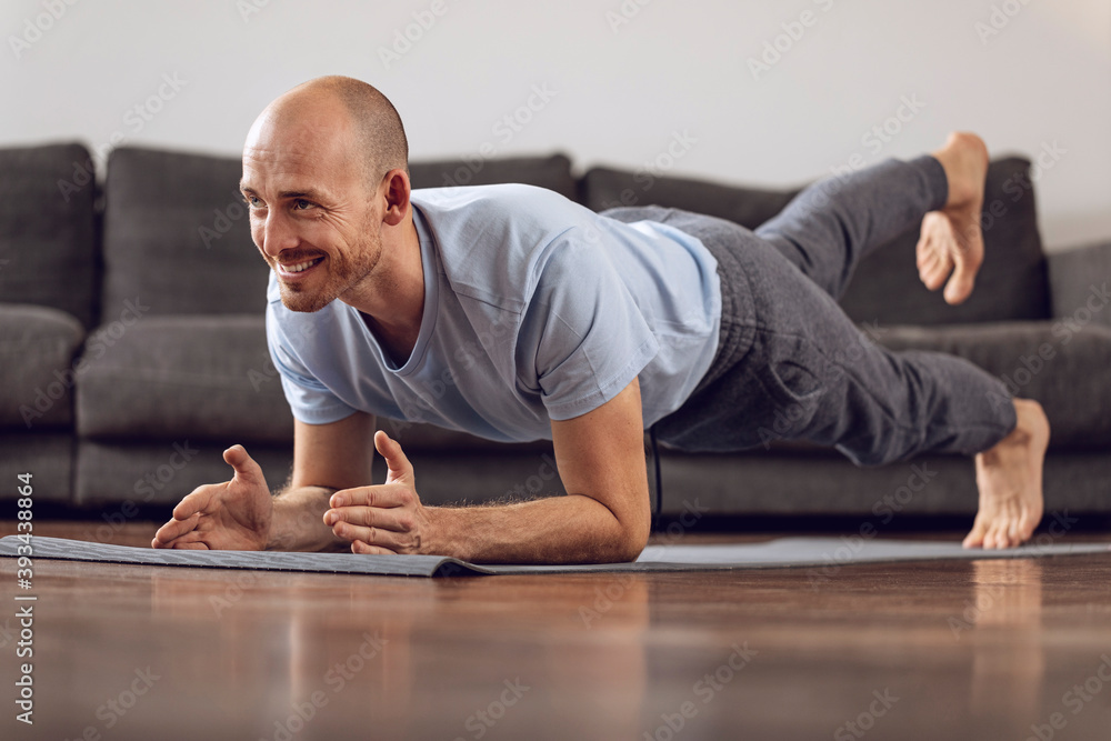 Man doing gymnastics at home Man doing gymnastics at home
