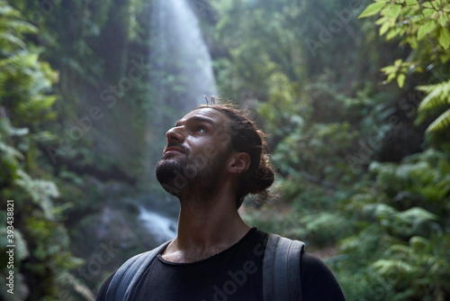 Spain, Canary Islands, La Palma, close-up of bearded man near a waterfall in the forest photo