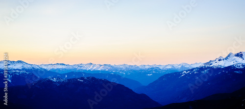 Dark snow-capped mountains at dusk. © ArchonCodex