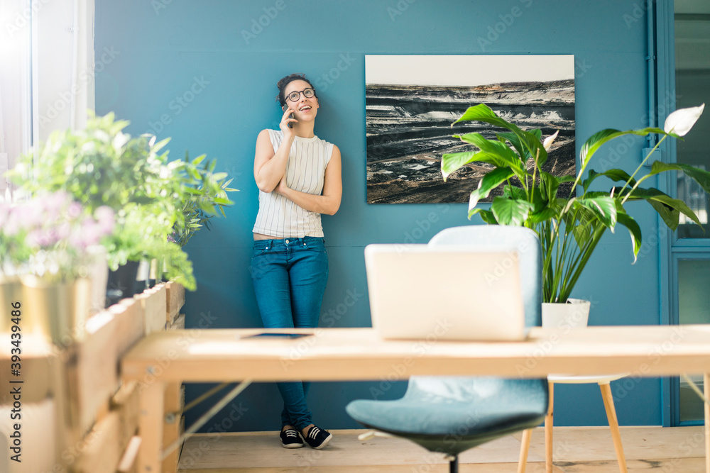 Freelancer on the phone in a loft Freelancer on the phone in a loft