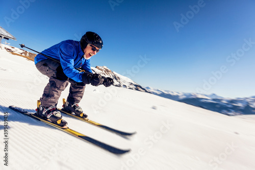 Austria, Damuels, happy senior man skiing in winter landscape