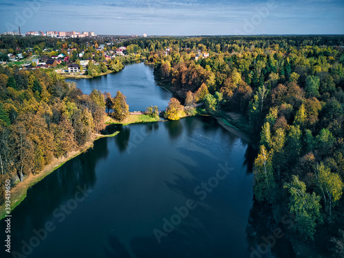 Trees covering lake in city photo