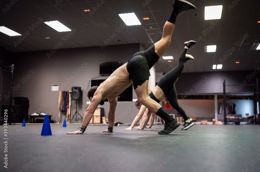 Male athletes exercising in gym Male athletes exercising in gym
