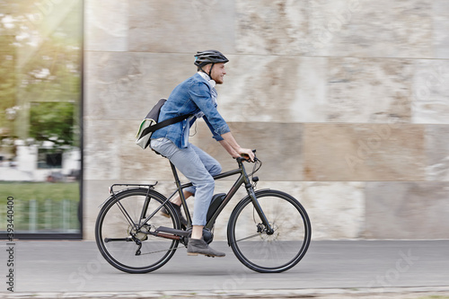 Student on his e-bike at Goethe University in Frankfurt, Germany