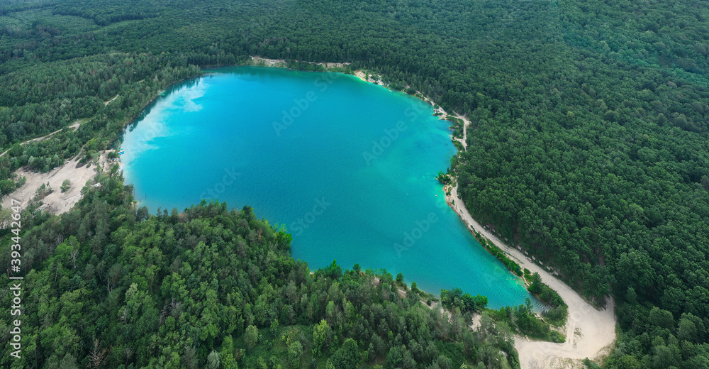 Lake in the forest with blue water.